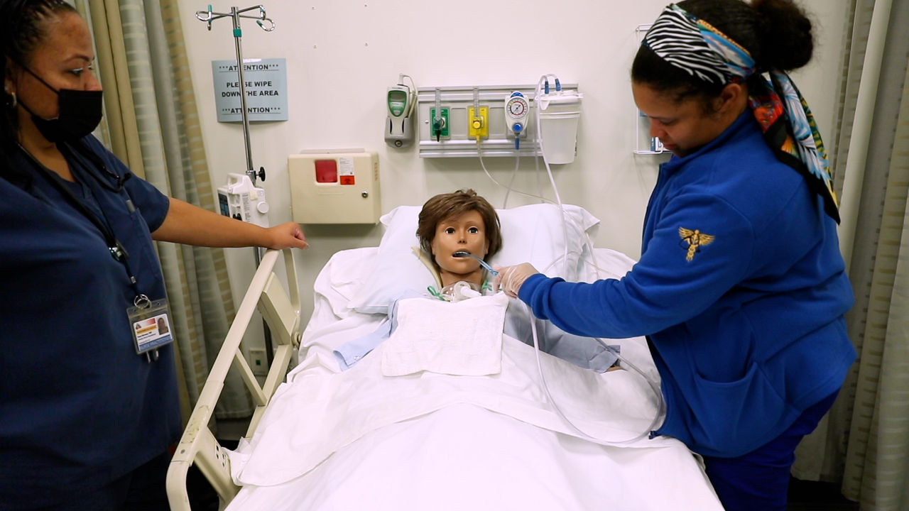 Child patient receiving care in hospital bed